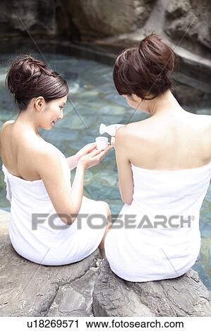 Japanese women drinking sake in a open-air bath View Large Photo Image Stock Image - Japanese women drinking sake in a open-air bath. Fotosearch