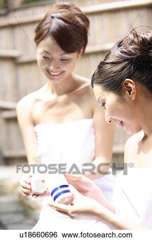 Japanese women drinking sake in a open-air bath View Large Photo Image Stock Photograph - Japanese women drinking sake in a open-air bath. Fotosearch