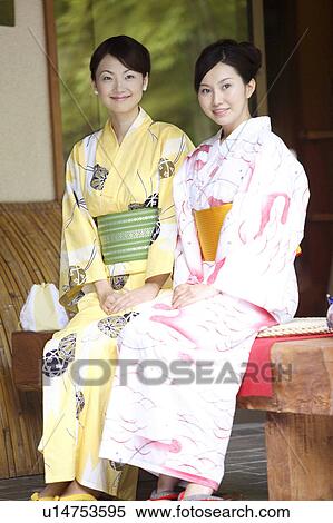 Japanese women putting on a yukata View Large Photo Image Stock Photography - Japanese women putting on a yukata. Fotosearch