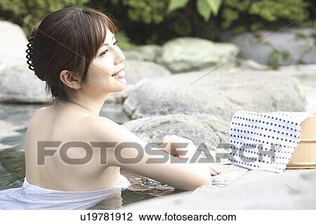 Woman soaking the open-air bath View Large Photo Image Stock Image - Woman soaking the open-air bath. Fotosearch