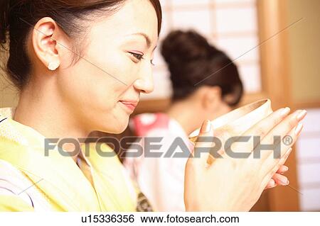 Women drinking green tea View Large Photo Image Stock Photograph - Women drinking green tea. Fotosearch