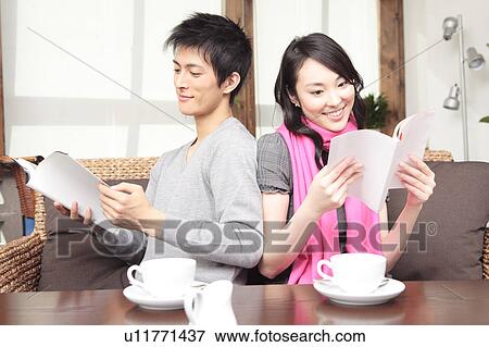 Stock Photo - Couple reading books. Fotosearch