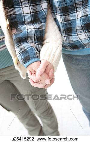 Stock Image - Hands of young couple. Fotosearch