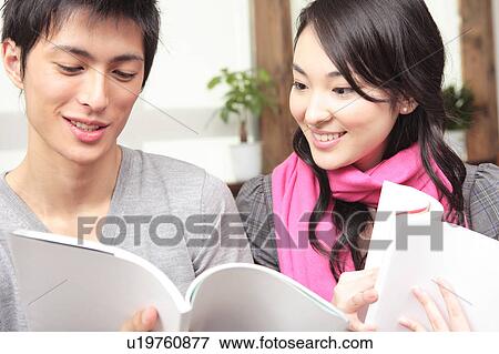 Stock Photo - Japanese couple reading books. Fotosearch