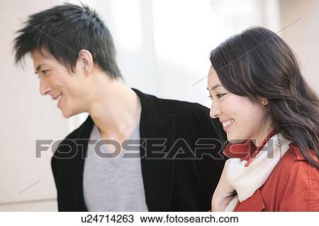 Japanese young couple enjoy window shopping View Large Photo Image Stock Image - Japanese young couple enjoy window shopping. Fotosearch