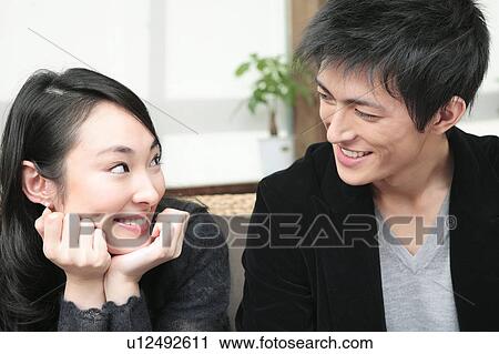 Stock Image - Jpanese couple gazing each other. Fotosearch