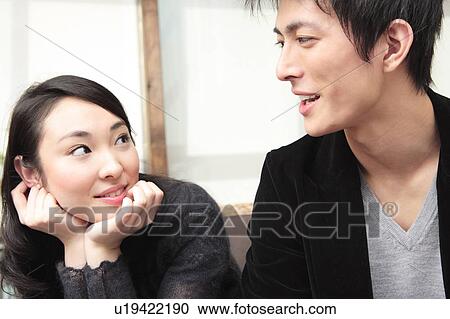 Stock Image - Jpanese couple gazing each other. Fotosearch