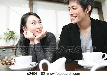 Stock Image - Jpanese couple gazing each other. Fotosearch