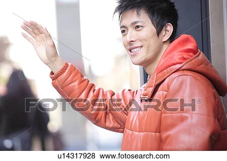 Stock Photo - Smiling Japanese young man. Fotosearch