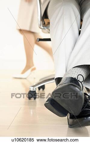 Stock Photography - Foot of office worker. Fotosearch