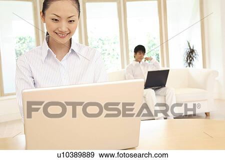 Office lady operating a PC View Large Photo Image Stock Photo - Office lady operating a PC. Fotosearch