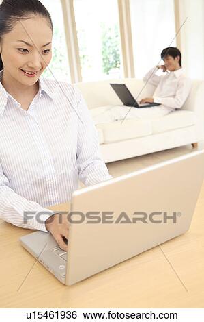 Stock Photograph - Office lady operating a PC. Fotosearch