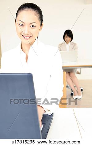 Stock Photography - Office lady operating a PC. Fotosearch