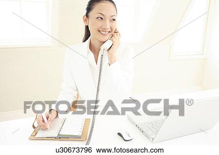 Office lady talking with phone View Large Photo Image Stock Photograph - Office lady talking with phone. Fotosearch