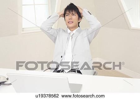 Stock Image - Office worker at wit's end. Fotosearch