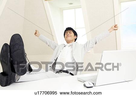 Office worker stretching back View Large Photo Image Stock Photography - Office worker stretching back. Fotosearch
