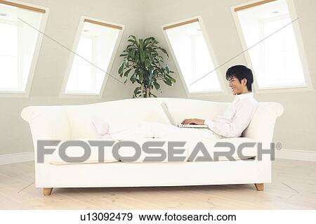 Stock Photo - Office worker taking a rest. Fotosearch