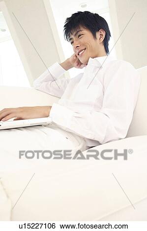 Stock Photograph - Office worker taking a rest. Fotosearch