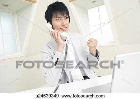 Office worker talking with phone View Large Photo Image Stock Photo - Office worker talking with phone. Fotosearch