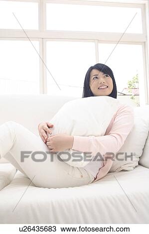 Stock Image - Portrait of young woman. Fotosearch