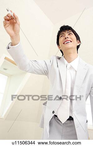 Picture - Smiling Japanese office worker. Fotosearch