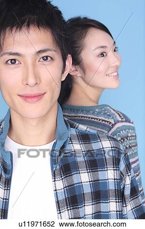 Stock Image - Portrait of Japanese young couple. Fotosearch