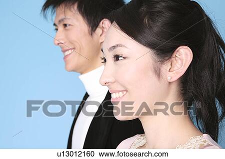 Stock Image - Portrait of young couple . Fotosearch