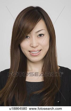 Stock Image - Portrait of a mid adult woman. Fotosearch