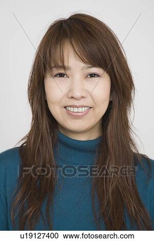 Stock Image - Portrait of a mid adult woman. Fotosearch