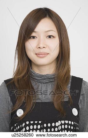 Stock Image - Portrait of a mid adult woman. Fotosearch