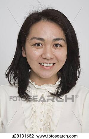 Stock Image - Portrait of a mid adult woman. Fotosearch