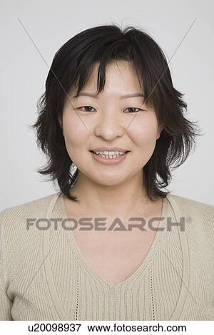 Stock Photo - Portrait of a mid adult woman. Fotosearch