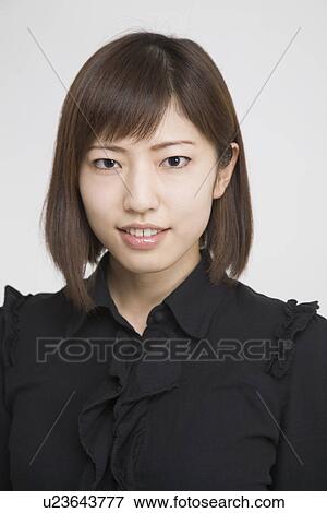 Stock Photo - Portrait of a mid adult woman. Fotosearch