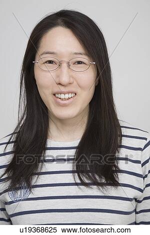Stock Photography - Portrait of a mid adult woman. Fotosearch