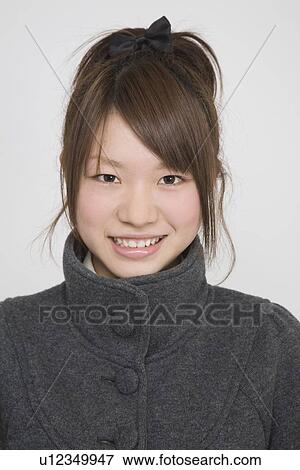 Stock Photo - Portrait of a young woman. Fotosearch