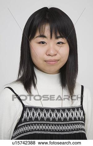 Portrait of a young woman View Large Photo Image Stock Photo - Portrait of a young woman. Fotosearch