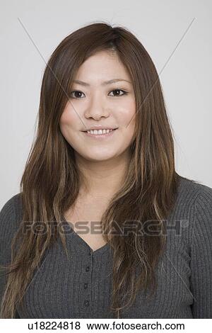 Portrait of a young woman View Large Photo Image Stock Photo - Portrait of a young woman. Fotosearch