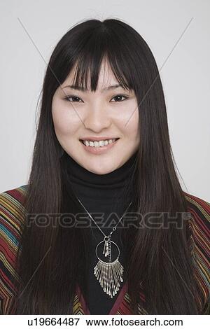 Portrait of a young woman View Large Photo Image Stock Photo - Portrait of a young woman. Fotosearch