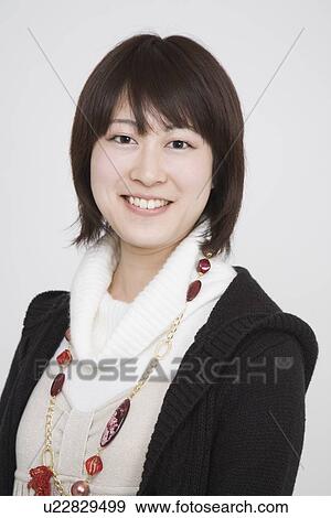 Stock Photo - Portrait of a young woman. Fotosearch