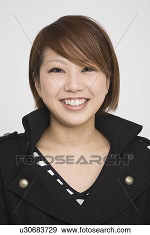 Stock Photo - Portrait of a young woman. Fotosearch