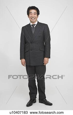 Portrait of a mid adult man standing View Large Photo Image Stock Image - Portrait of a mid adult man standing. Fotosearch
