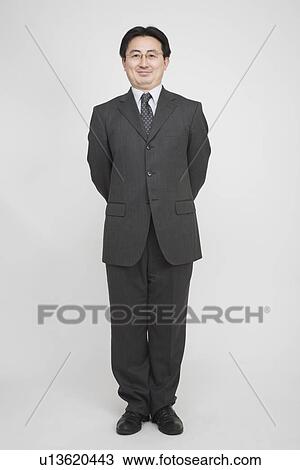 Portrait of a mid adult man standing View Large Photo Image Stock Image - Portrait of a mid adult man standing. Fotosearch
