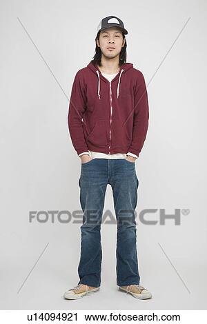 Stock Image - Portrait of a mid adult man standing. Fotosearch