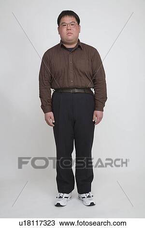 Portrait of a mid adult man standing View Large Photo Image Stock Image - Portrait of a mid adult man standing. Fotosearch