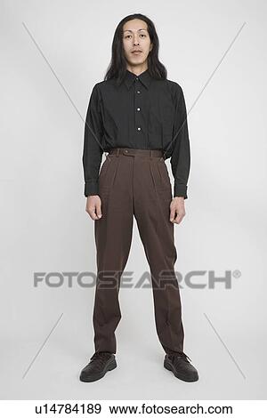 Portrait of a mid adult man standing View Large Photo Image Stock Photo - Portrait of a mid adult man standing. Fotosearch