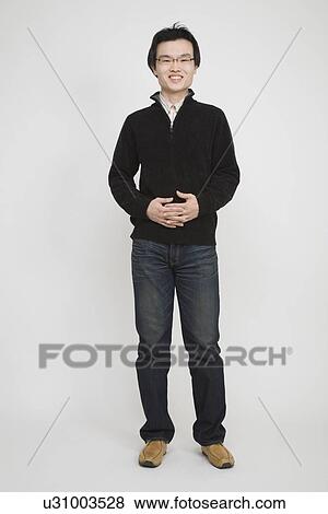 Portrait of a mid adult man standing View Large Photo Image Stock Photo - Portrait of a mid adult man standing. Fotosearch