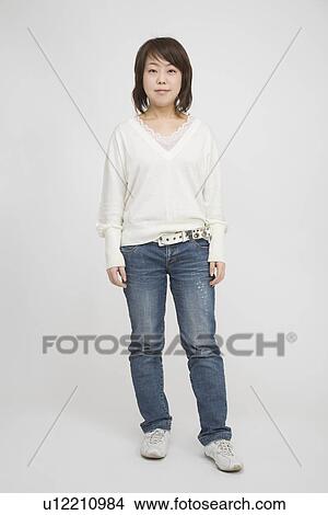 Picture - Portrait of a mid adult woman standing. Fotosearch