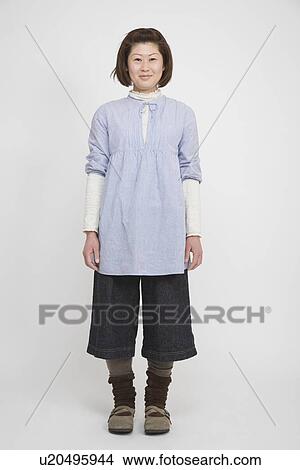 Picture - Portrait of a mid adult woman standing. Fotosearch