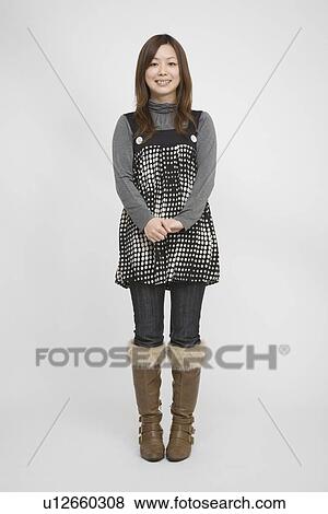 Portrait of a mid adult woman standing View Large Photo Image Stock Photo - Portrait of a mid adult woman standing. Fotosearch