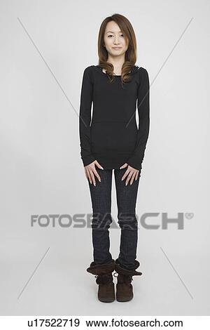 Portrait of a mid adult woman standing View Large Photo Image Stock Photo - Portrait of a mid adult woman standing. Fotosearch